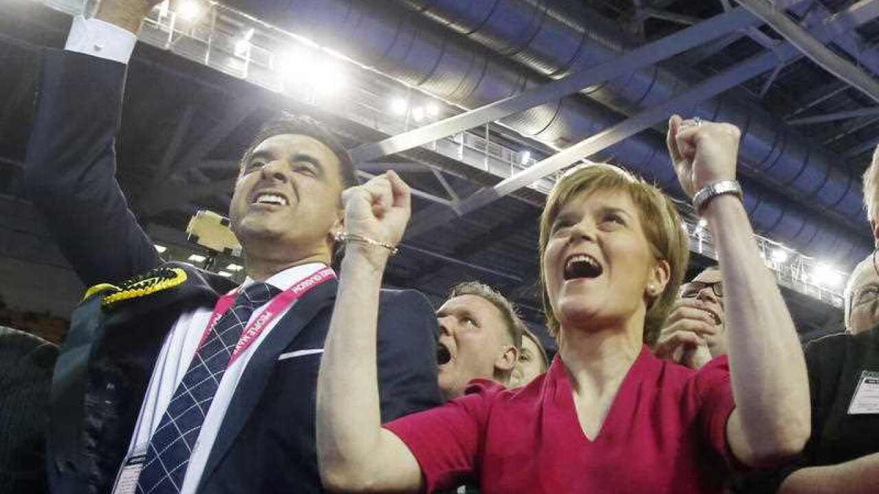 SNP leader Nicola Sturgeon celebrates winning all seven Glasgow constituencies at the Emirates Arena in Glasgow (AAP)