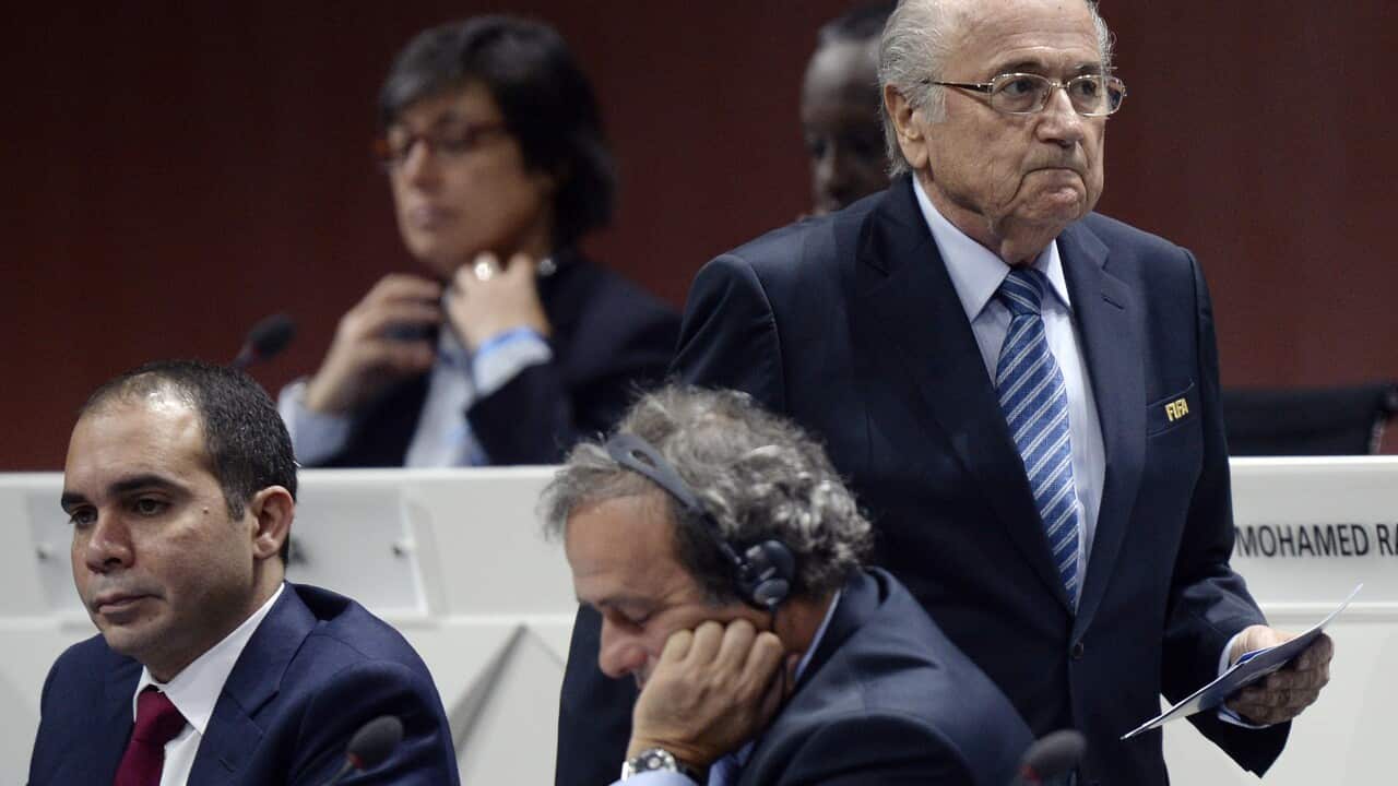 Joseph S. Blatter, right, walks past Prince Ali bin al-Hussein and UEFA President Michel Platini, center, during the 65th FIFA Congress