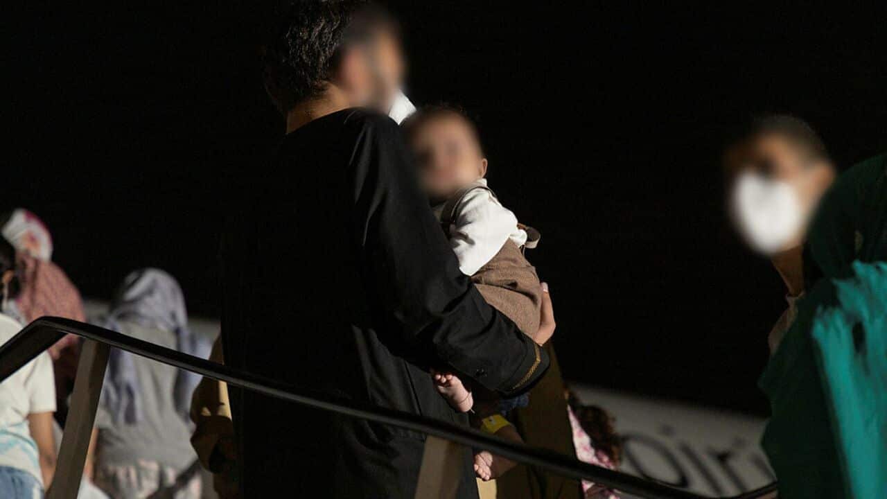 Afghanistan evacuees at Australia's main operating base in the Middle East board a Qantas B787-9 Dreamliner aircraft bound for Australia.
