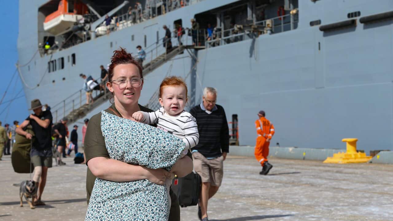 Evacuees from Mallacoota arrive on the Australian Navy ship HMAS Choules at the port of Hastings, Victoria.
