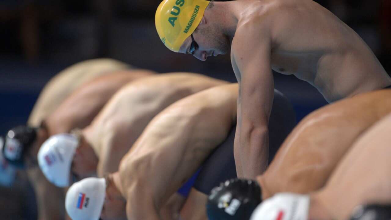 Focused Magnussen sizzles in 100m heats