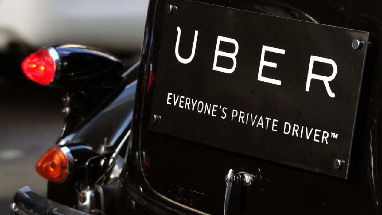 Uber signage seen on a vintage car