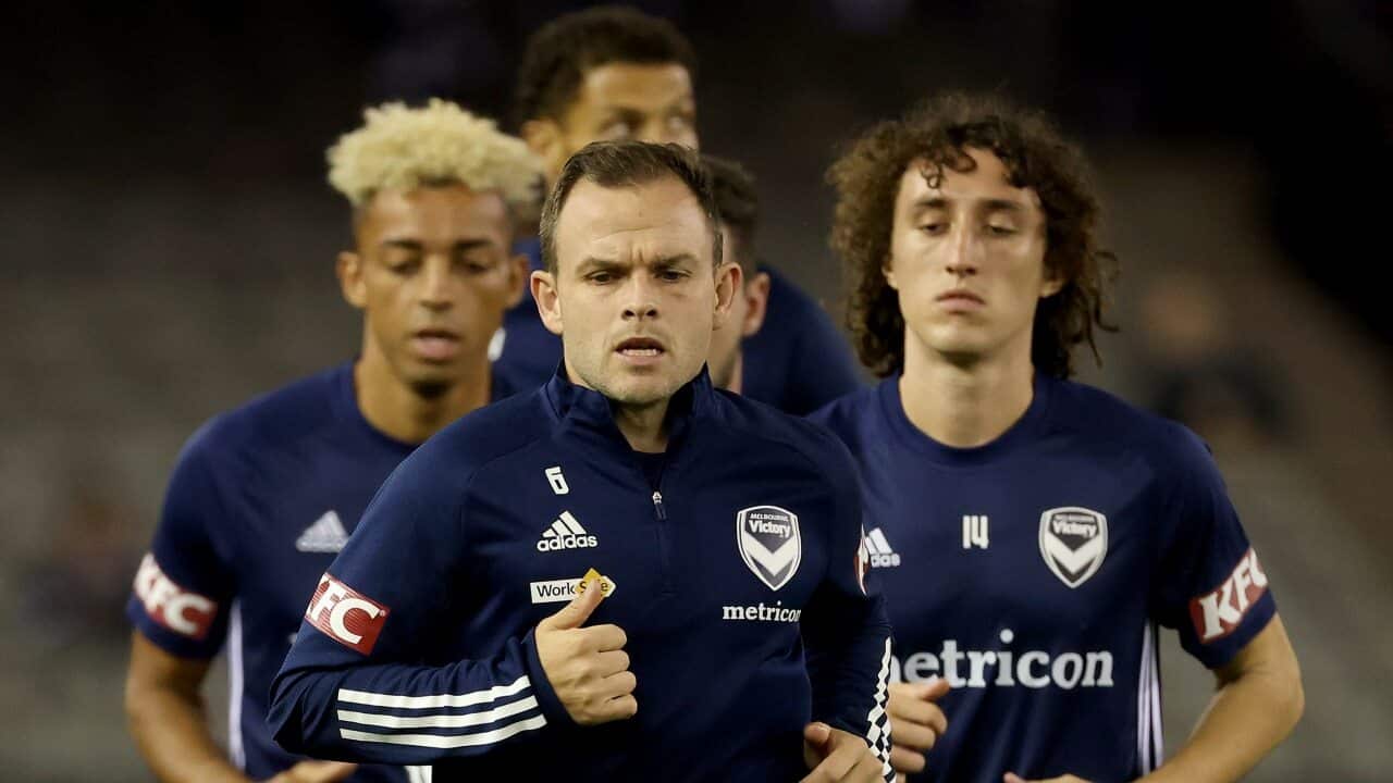 Melbourne Victory players warm up before a match