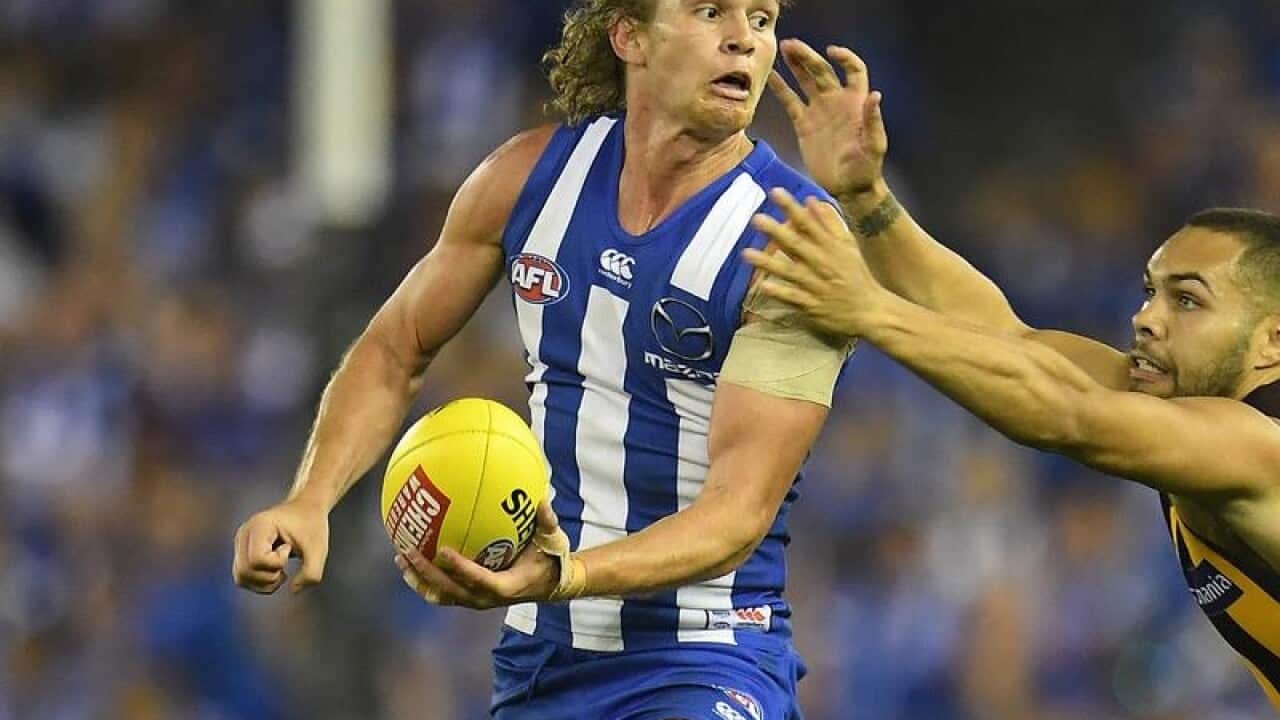 File image of Jed Anderson of the Kangaroos in control of the ball.