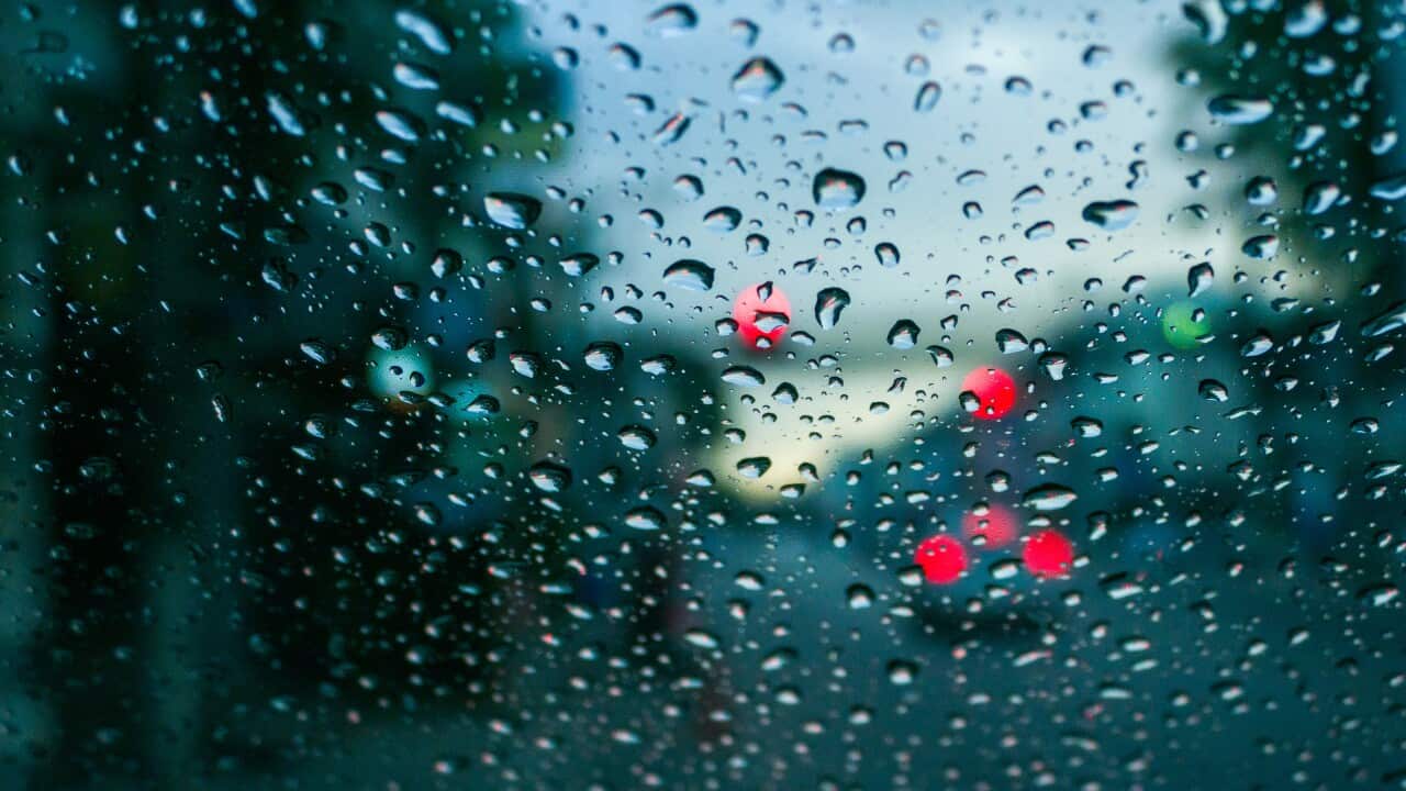 Raindrops stuck to car windshield