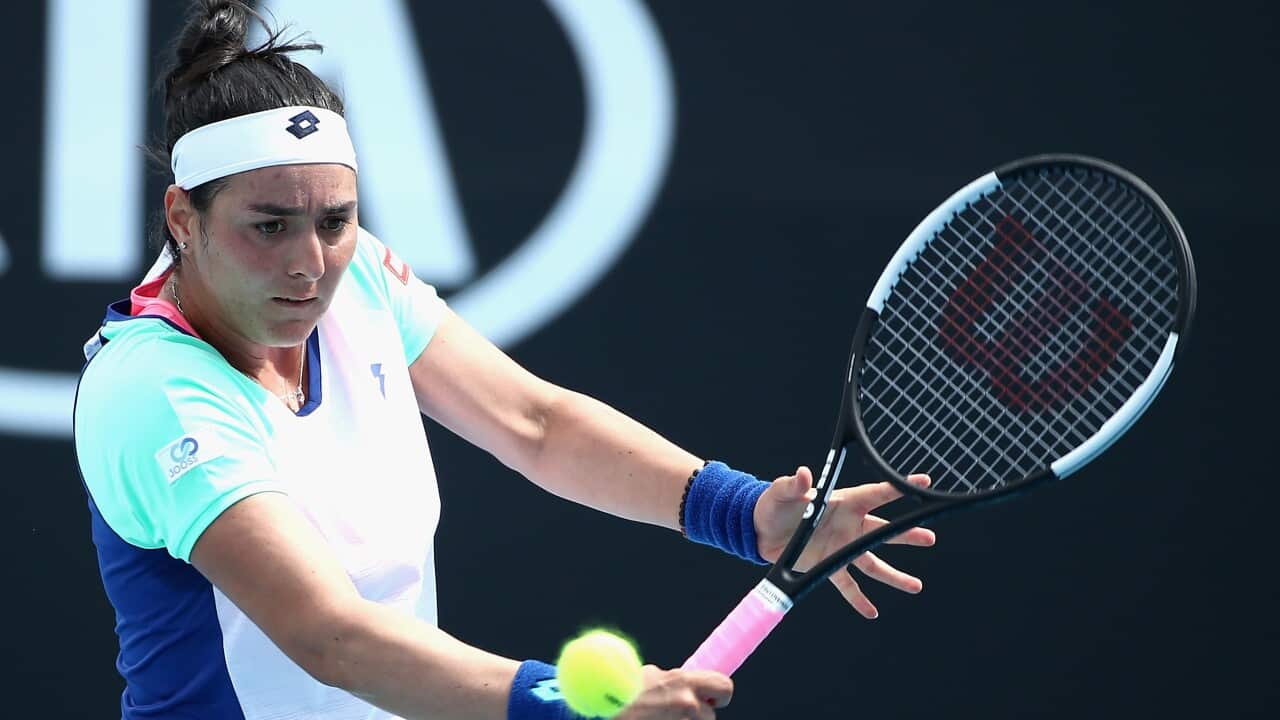 Ons Jabeur of Tunisia plays a backhand in her singles match against Johanna Konta of United Kingdom during day two of the Australian Open tennis tournament in Melbourne, Tuesday, January 21, 2020. (AAP Image/Rob Prezioso) NO ARCHIVING, EDITORIAL USE ONLY