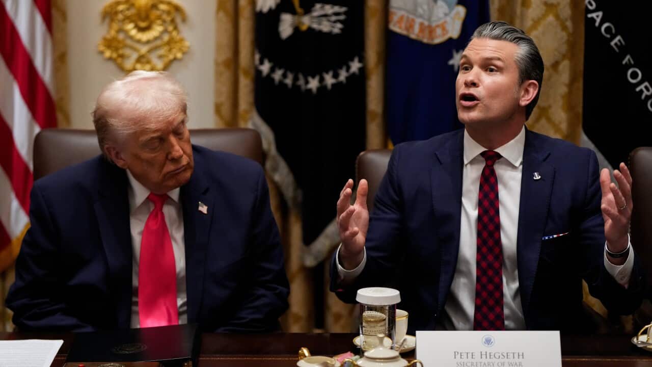 President Donald Trump and Defence Secretary Pete Hegseth speak during a Cabinet meeting at the White House, in Washington DC.