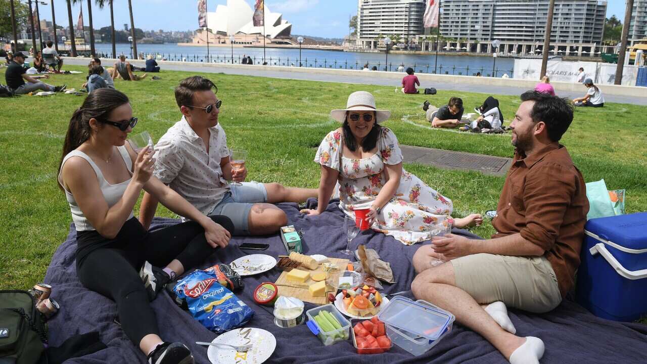 (L-R) Fabie McGechan, Demitris van Maaren, Melanie Marsden and Joel hutchings are seen enjoying a picnic at the Museum of Contemporary Art Lawn, in Sydney