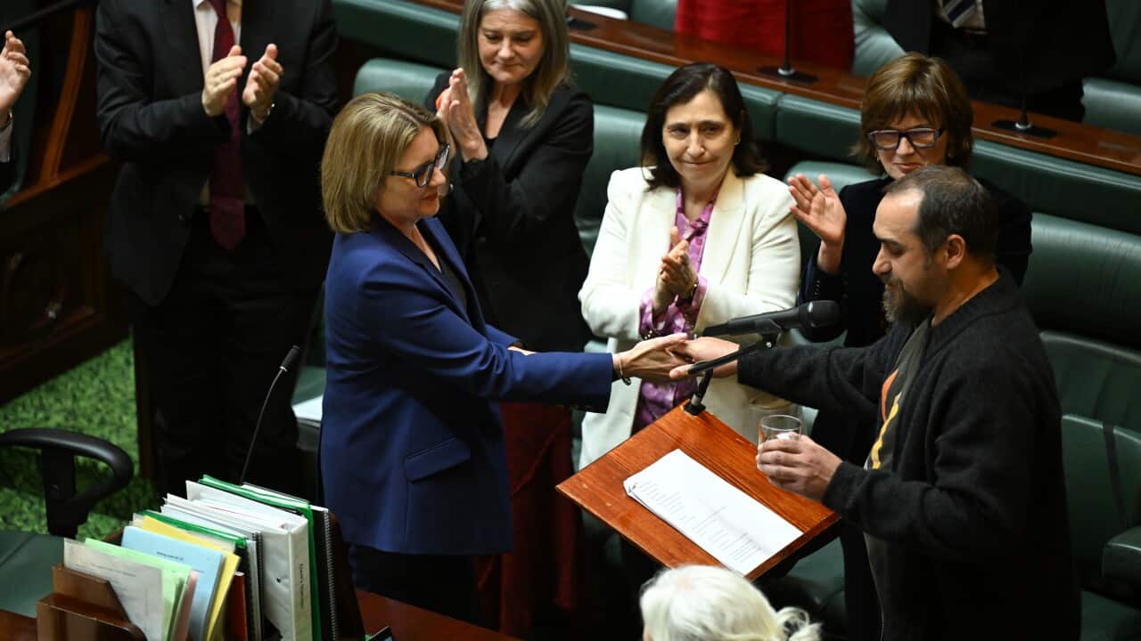 Victorian Premier Jacinta Allan (left) shakes hands with Assembly Co-Chair Rueben Berg (right) after delivering a speech from the floor of Victorian Legislative Assembly at the Parliament of Victoria in Melbourne, Tuesday, October 14, 2025.