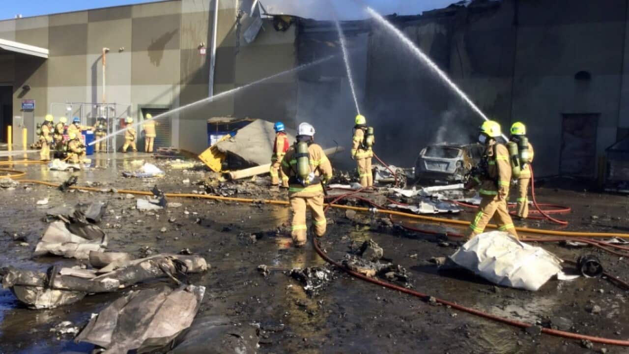 Firefighters putting out the fire after the crash, via Twitter