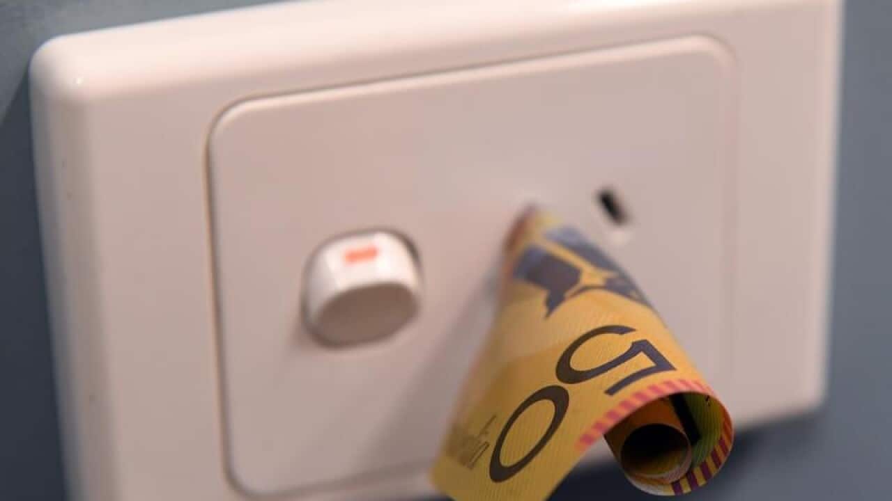 A $50 note is seen inserted into a power point in Melbourne
