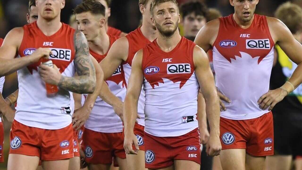 Sydney Swans players react to their loss