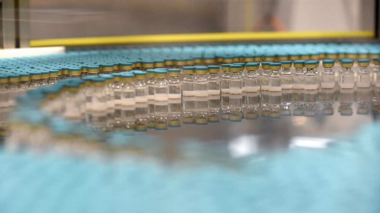 Vaccine vials on a production line at a factory in northern France