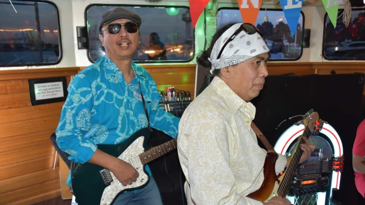 Dr Putu Pendit (left) and the band entertaining those on board of the Calypso Lady with Indonesian and other favourite songs from the past while enjoying sunset along the Yarra, Melb 24 Nov 2019.