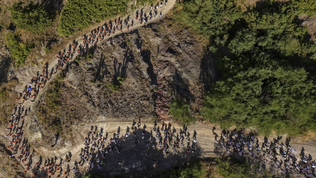 People participate in the March of Peace to remember the 1995 Srebrenica massacre, in Nezuk, Bosnia (AAP)