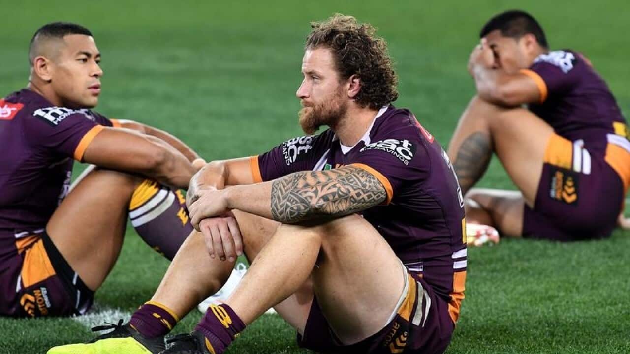 Korbin Sims (centre) of the Broncos.