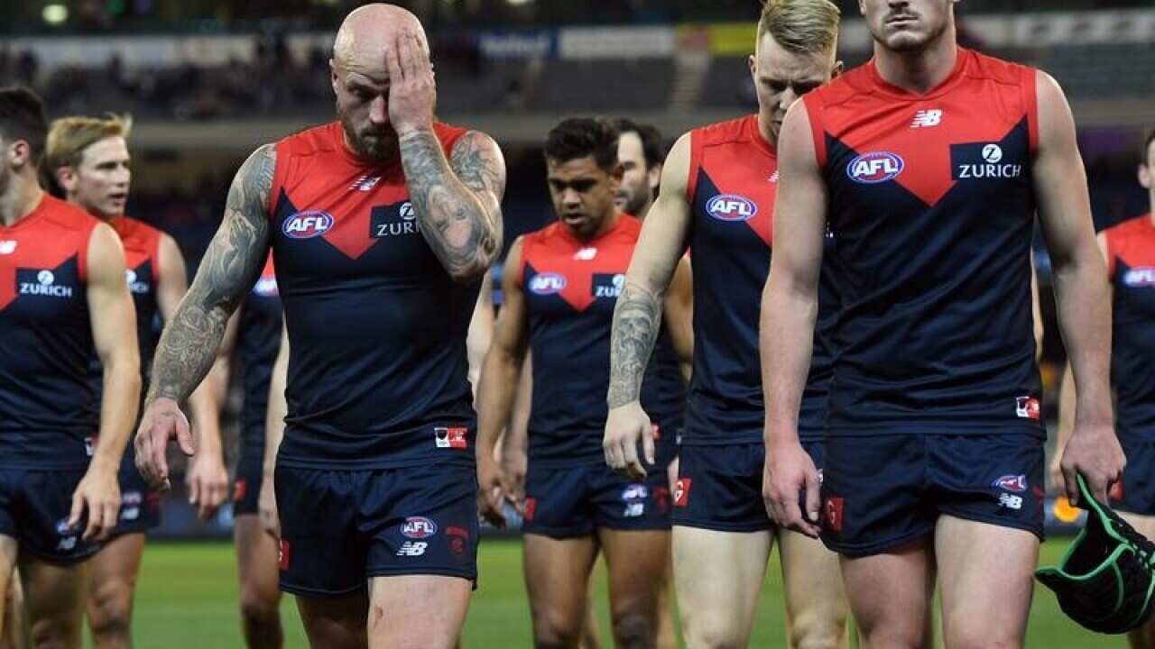 Demons players leave the ground