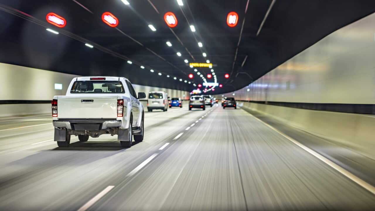 Driving in tunnel, ute pickup truck, highway road