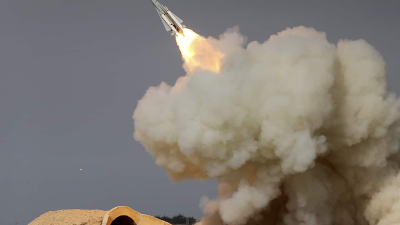 A long-range missile is fired in a military drill in Iran