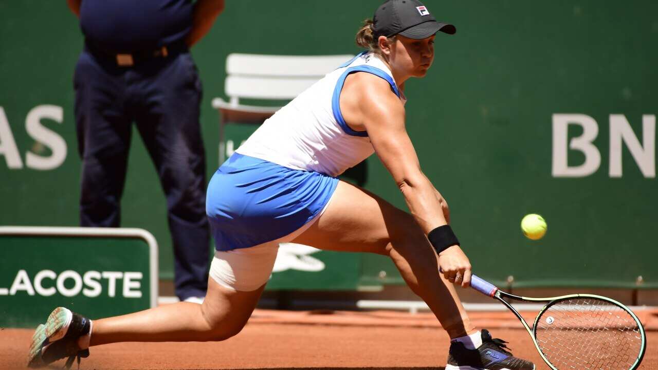 Ashleigh Barty of Australia hits a backhand during the 1st round match against Bernarda Pera of the US at the French Open tennis tournament at Roland Garros in Paris, France, 01 June 2021.  EPA/CAROLINE BLUMBERG