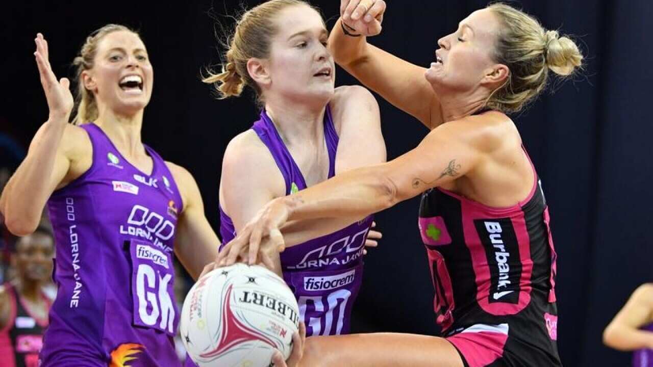 The Firebirds' Tara Hinchliffe clashes with Thunderbird Chelsea Pitman