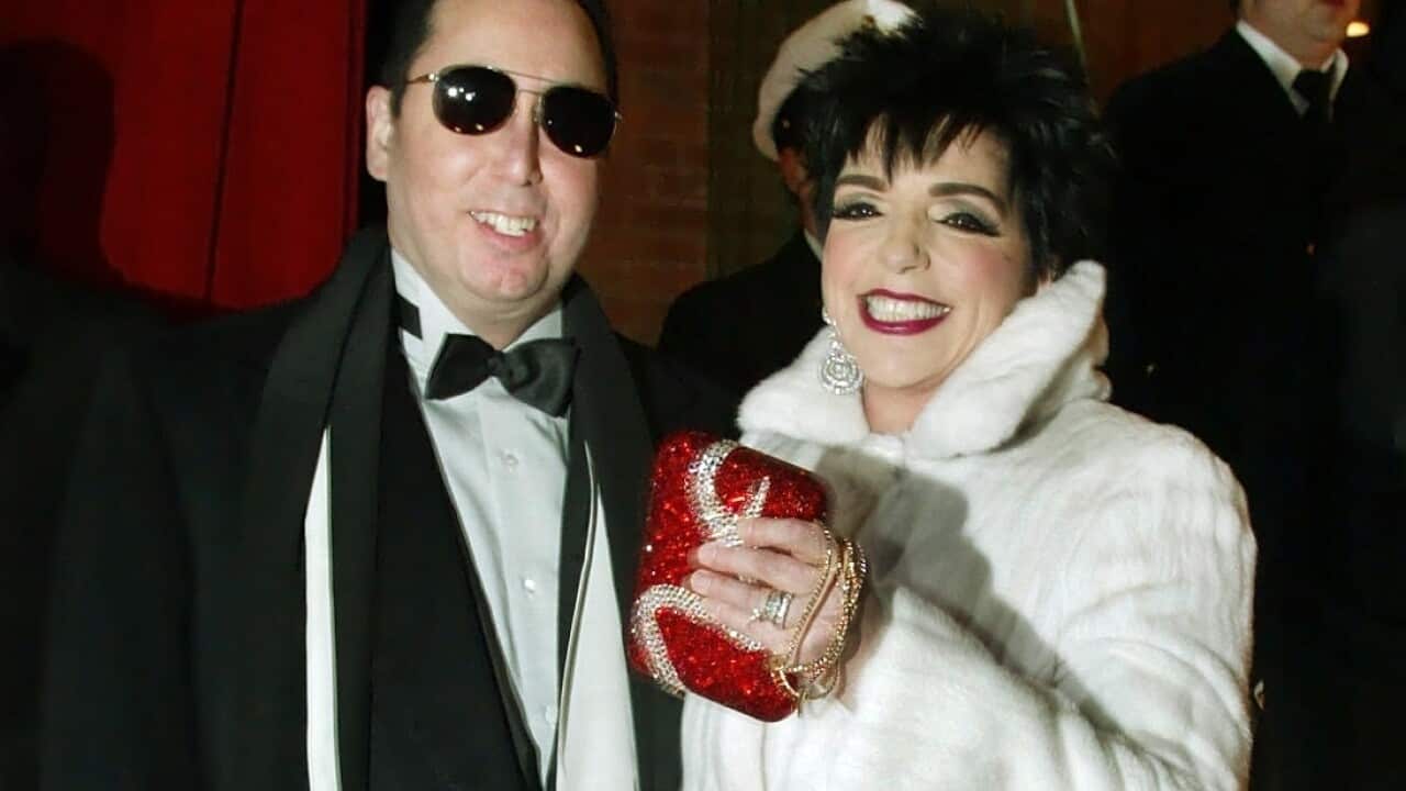 In this file photo Liza Minnelli, right, and her husband David Gest, left, pose for photographers upon their arrival at the musical theatre "Neue Flora" 