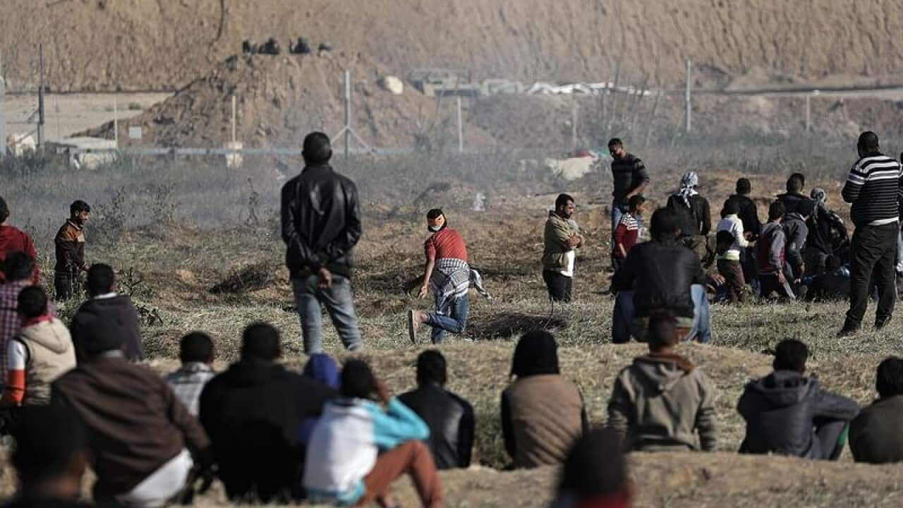 Palestinians protesters at the Gaza-Israel border