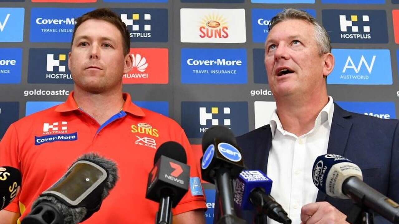 Gold Coast Suns coach Stuart Dew (L) and CEO Mark Evans (R)