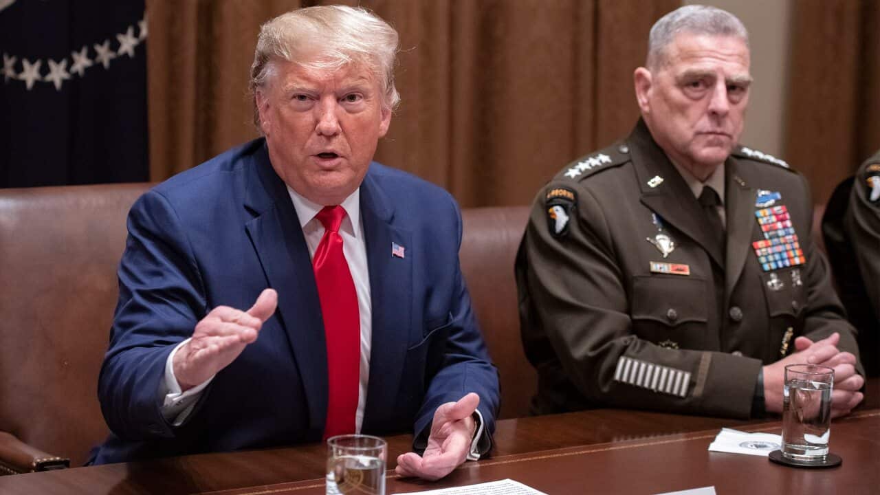 US President Donald Trump answers a reporter's question as he participates in a briefing with senior military leaders in the Cabinet Room of the White House