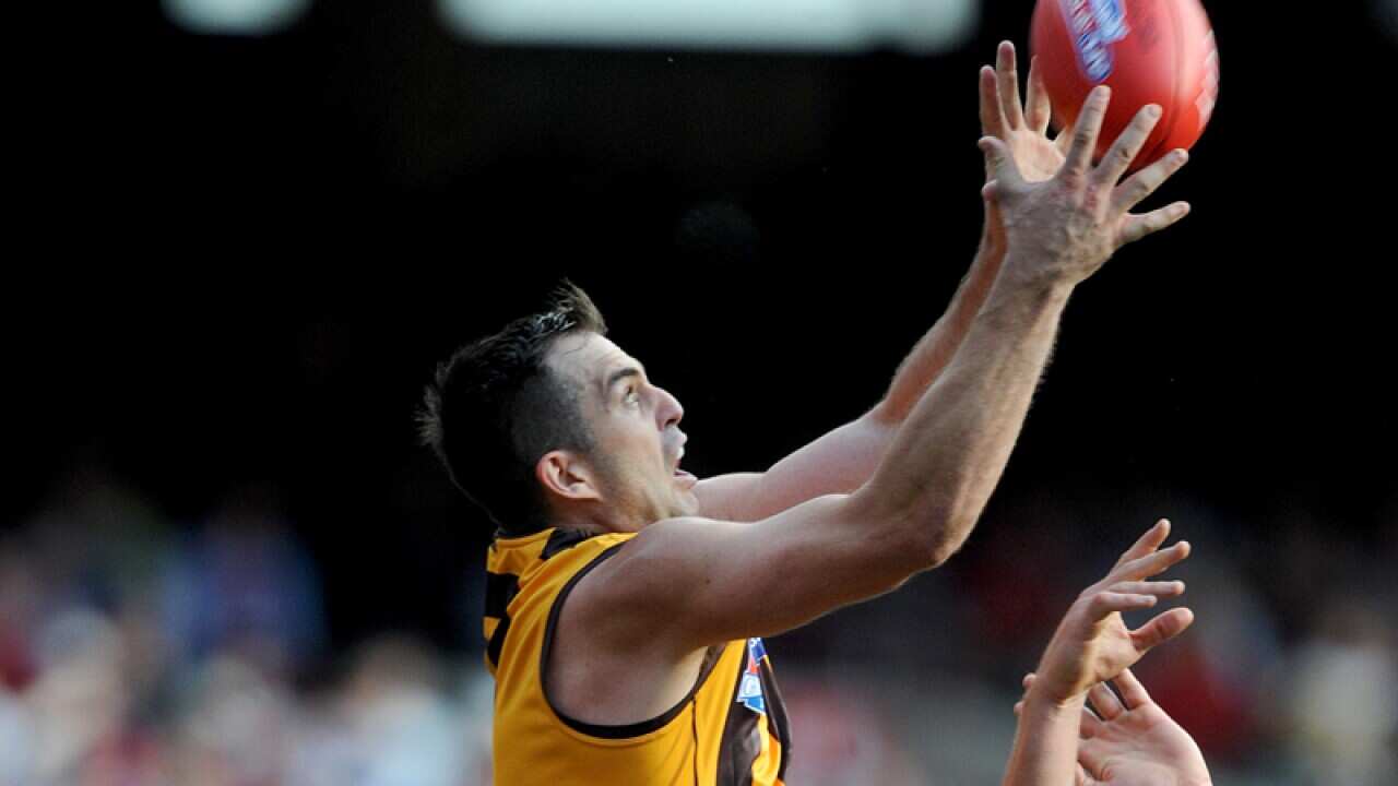 Brian Lake of Hawthorn takes a mark