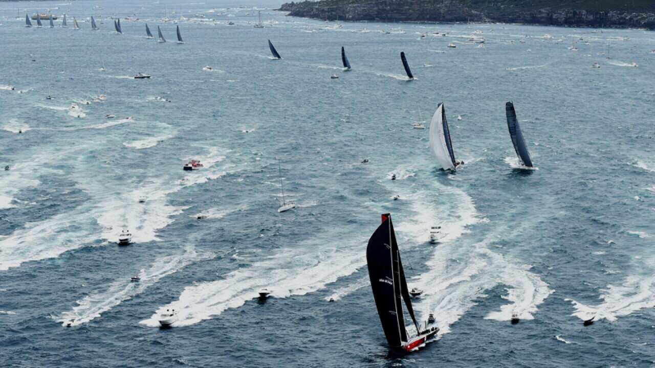 Comanche leads the fleet through the heads.