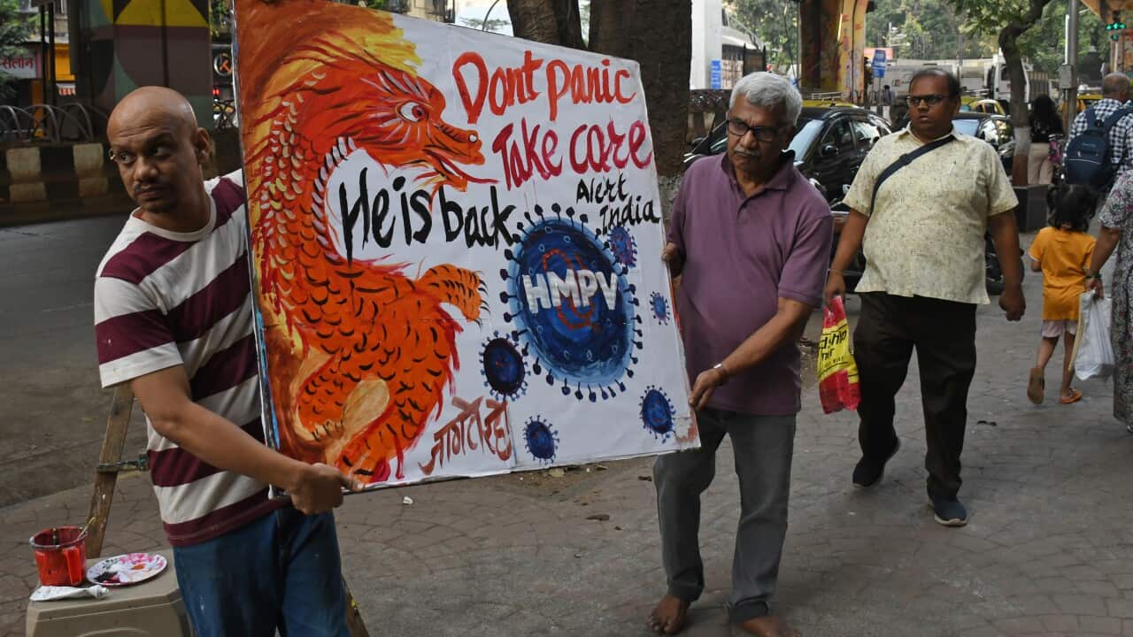 Gurukul school of art paints an awareness poster on Human metapneumovirus (HMPV) in Mumbai, India - 6 Jan 2025