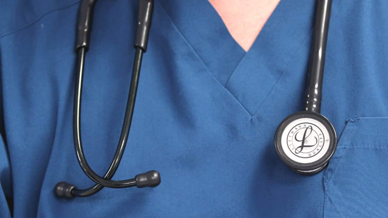 A Doctor holds a stethoscope