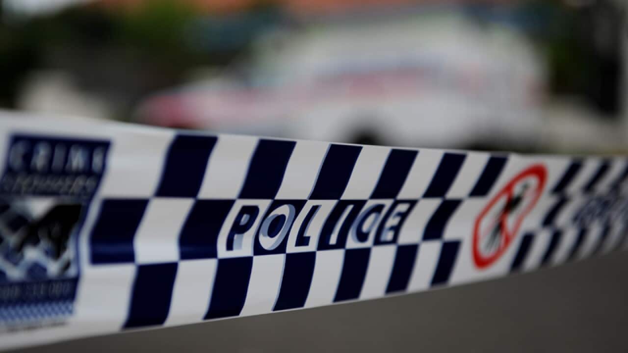 Police tape restricts access to a street in Sydney