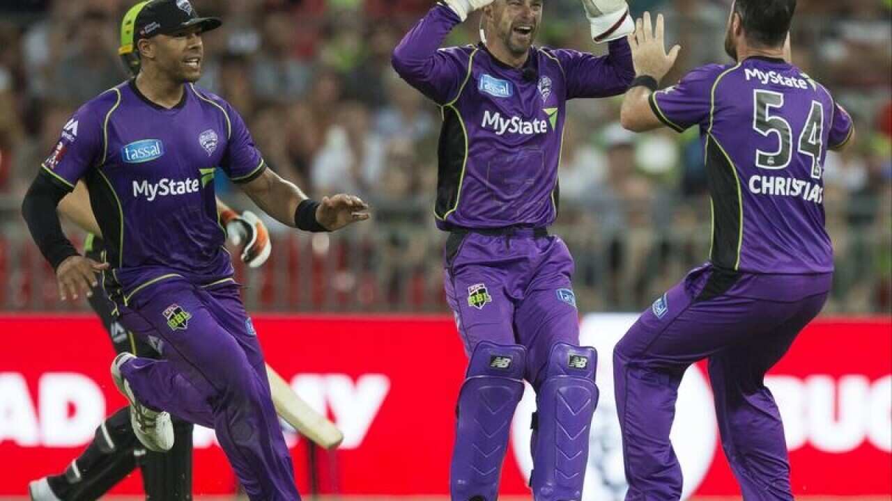 Matthew Wade celebrates after running out Jos Butler