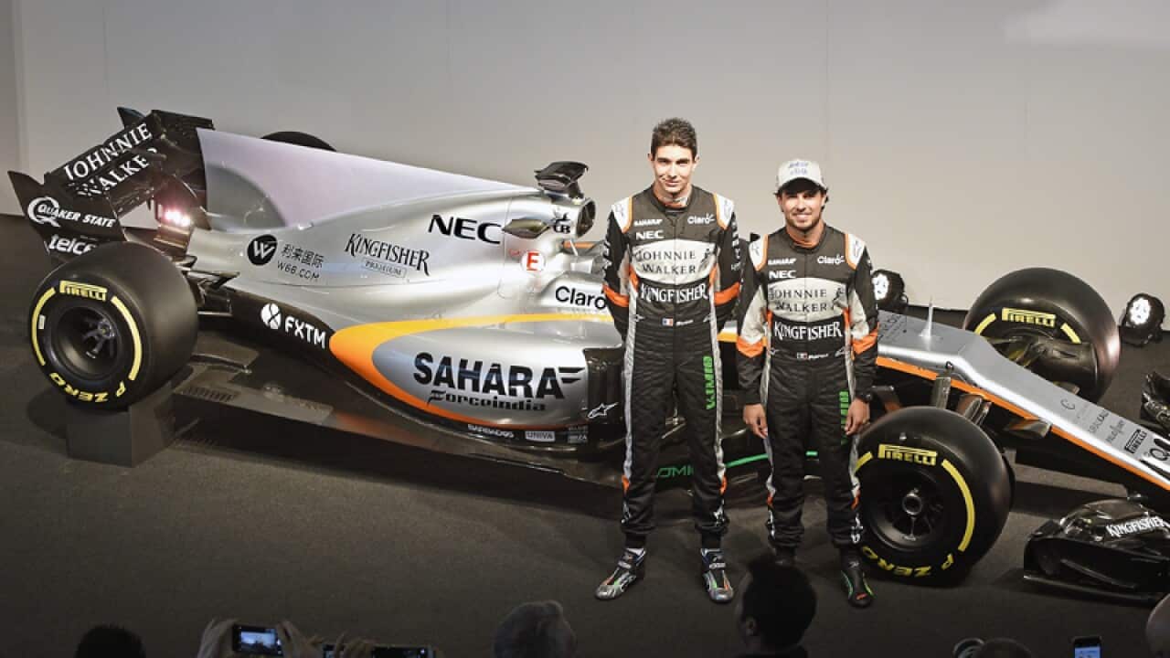 Formula One drivers Sergio Perez of Mexico and Esteban Ocon of France