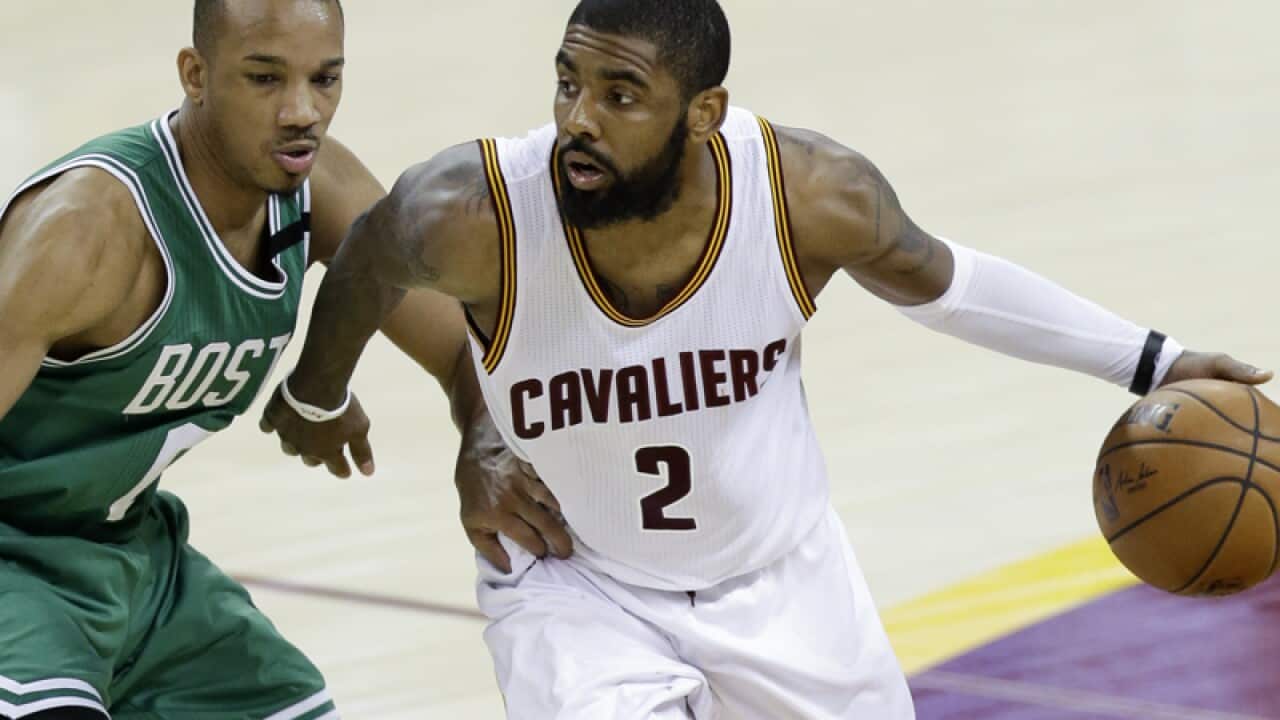 Cleveland Cavaliers' Kyrie Irving (R)