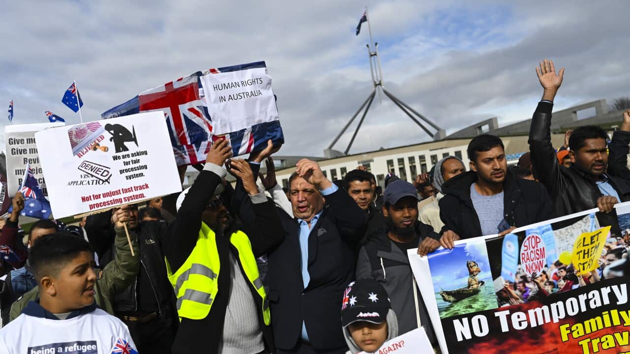 Temporary Protection Visa (TPV) and Safe Haven Enterprise Visa (SHEV) holders are seen as they attend a rally outside Parliament House in Canberra, Monday, 29 July, 2019. (AAP Image/Lukas Coch) NO ARCHIVING