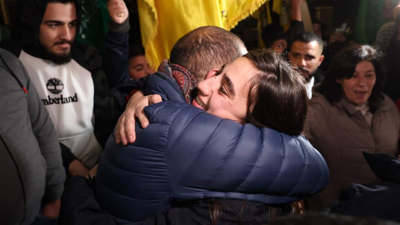 A Palestinian prisoner hugs a relative upon returning from the Ofer Israeli military prison to Ramallah