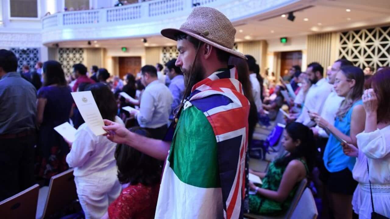 Australian citizenship recipients and their guests attend a citizenship ceremony on Australia Day in Brisbane, Thursday, Jan. 26, 2017. (AAP Image/Dan Peled) NO ARCHIVING