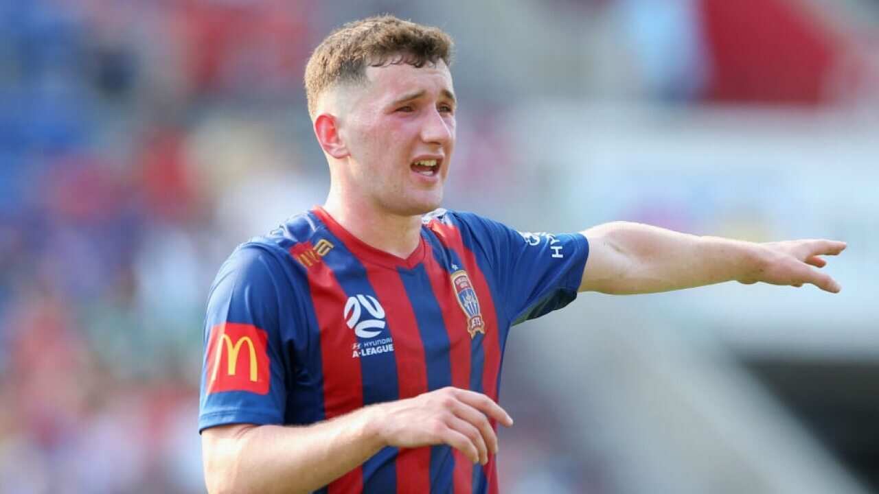 Bobby Burns reacts during a match for the Newcastle Jets