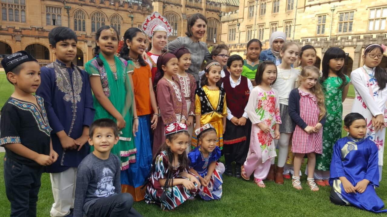 NSW Premier Gladys Berejiklian with school children launching the community language education program (SBS)