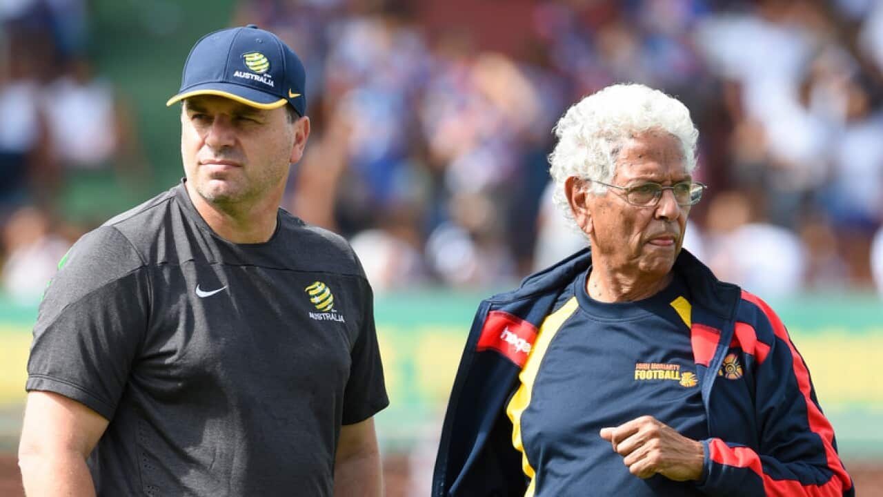 Socceroos coach Ange Postecoglou (left) speaks to John Moriarty.