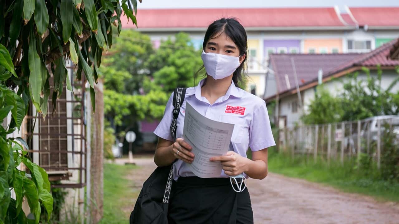 A Lao student on her way to school (Xinhua - Kaikeo Saiyasane via Getty)