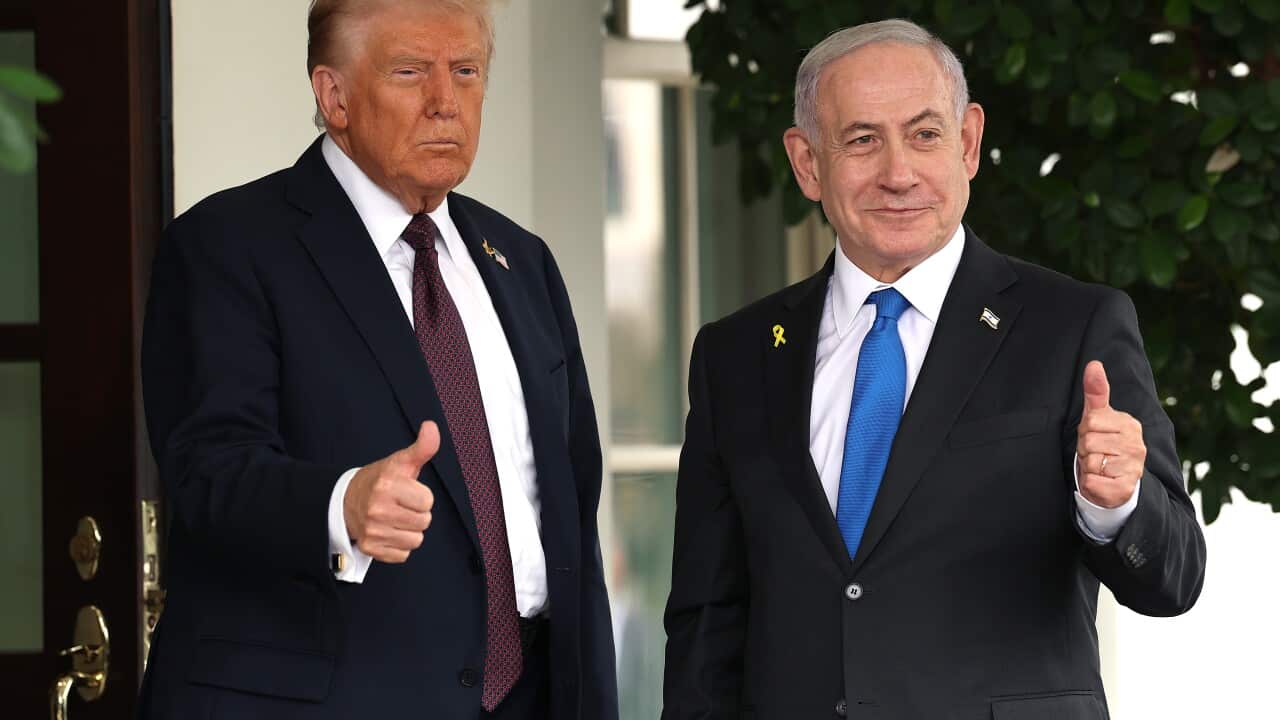 Israel's Benjamin Netanyahu stands with Donald Trump, with both men giving a thumbs up.