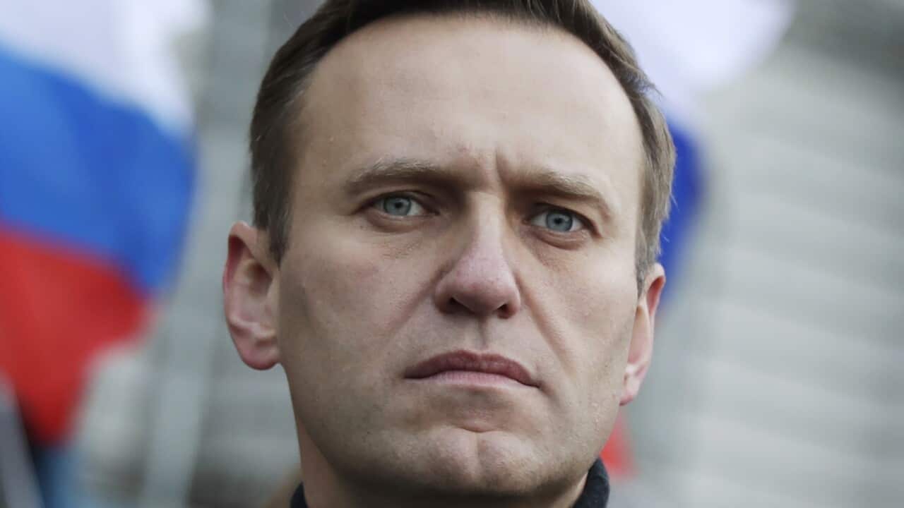 Alexei Navalny staring down a camera.