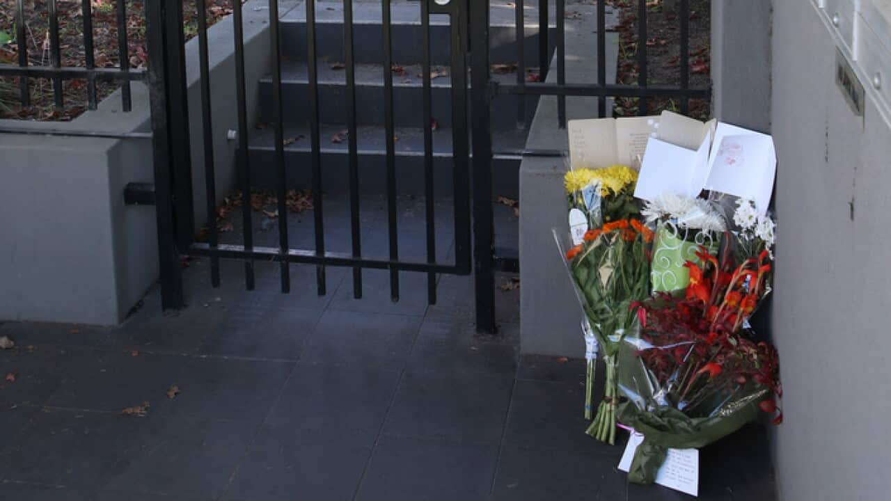 Flowers have been left at the entrance to the Buckingham apartments in Brighton.