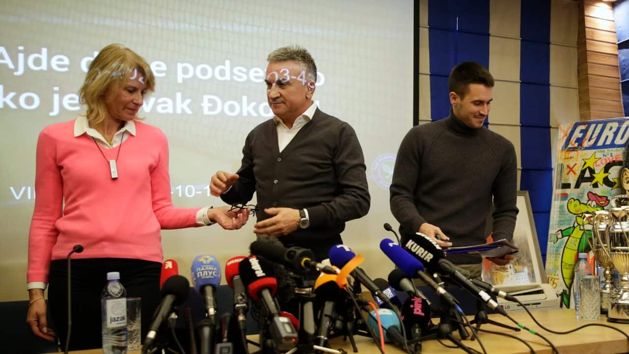 Novak Djokovic's mother Diana (L), father Srdjan (C), and brother Djordje (R) leave the press conference in Belgrade, Serbia