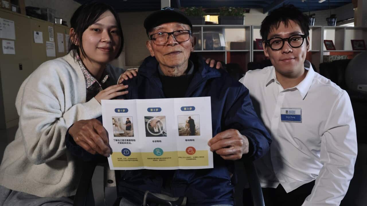 University students Zhou Yuening and Zhang Shijie with elder Liu Xuxiang at a falls prevention workshop in Perth (Christopher Tan SBS).jpg