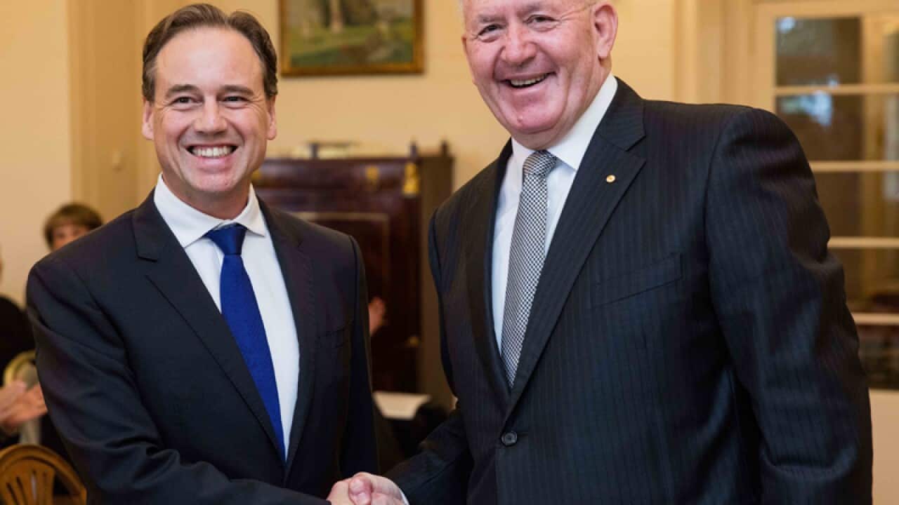 New Innovation minister Greg Hunt (L)
